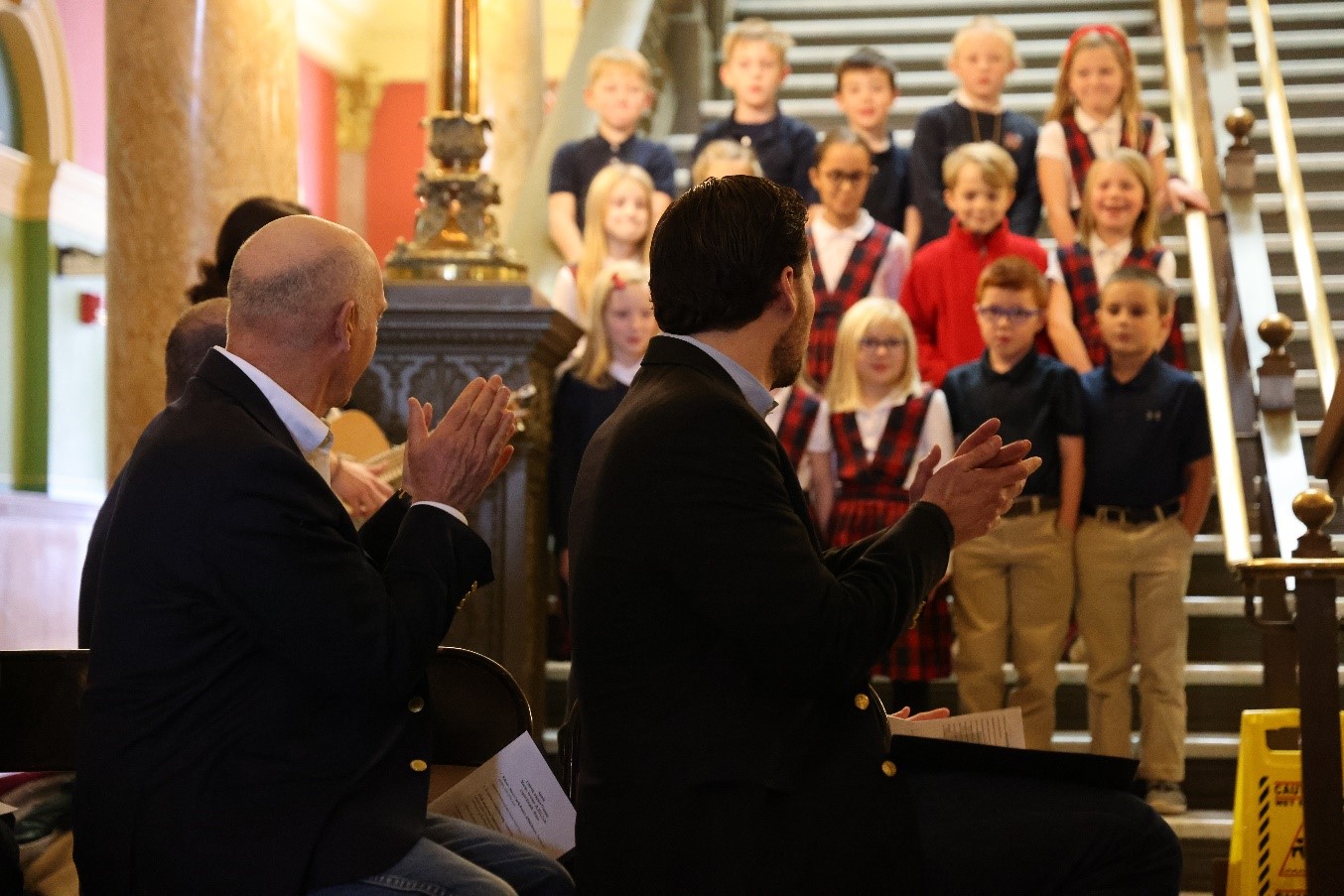 Gov. Gianforte and Director Brereton lead an applause for the St. Andrews Youth Choir at the Celebrate Adoption event at the State Capitol