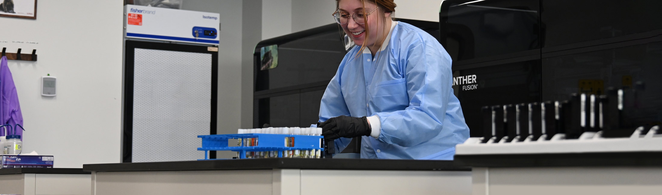 woman working on table in state lab 