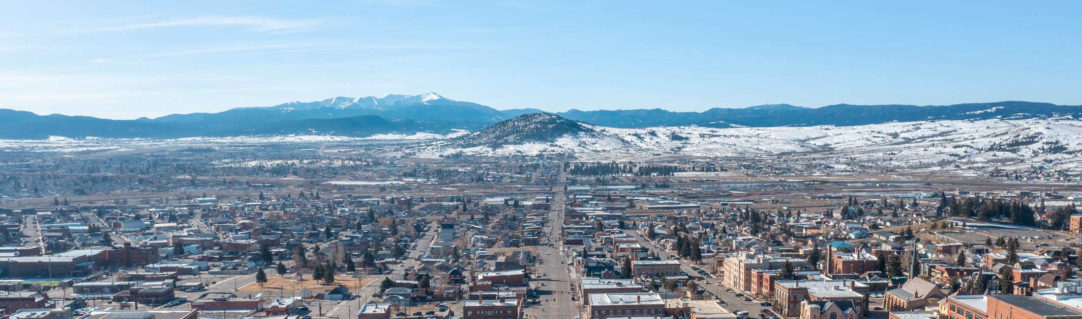 aerial view of city with mountains in background