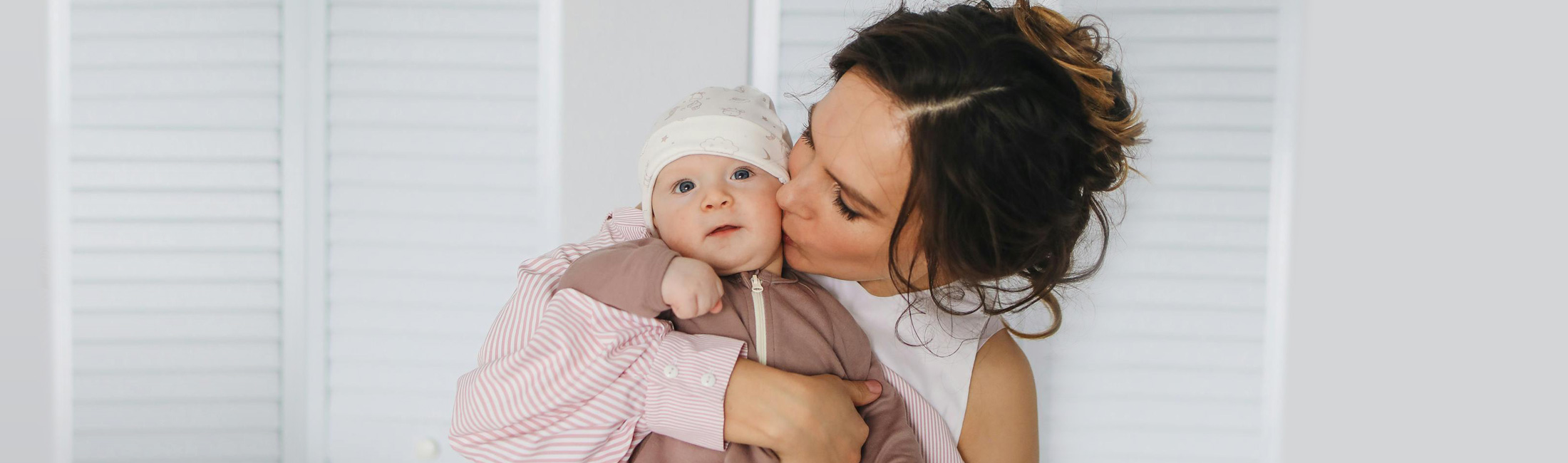 Woman holding young baby