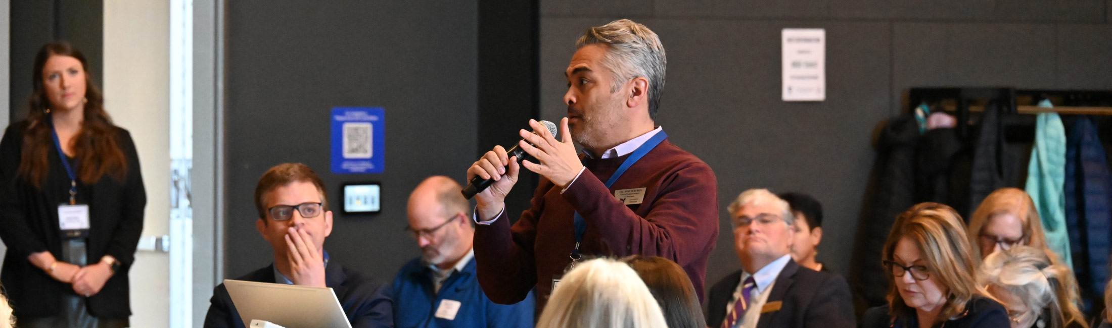 man speaking into microphone
