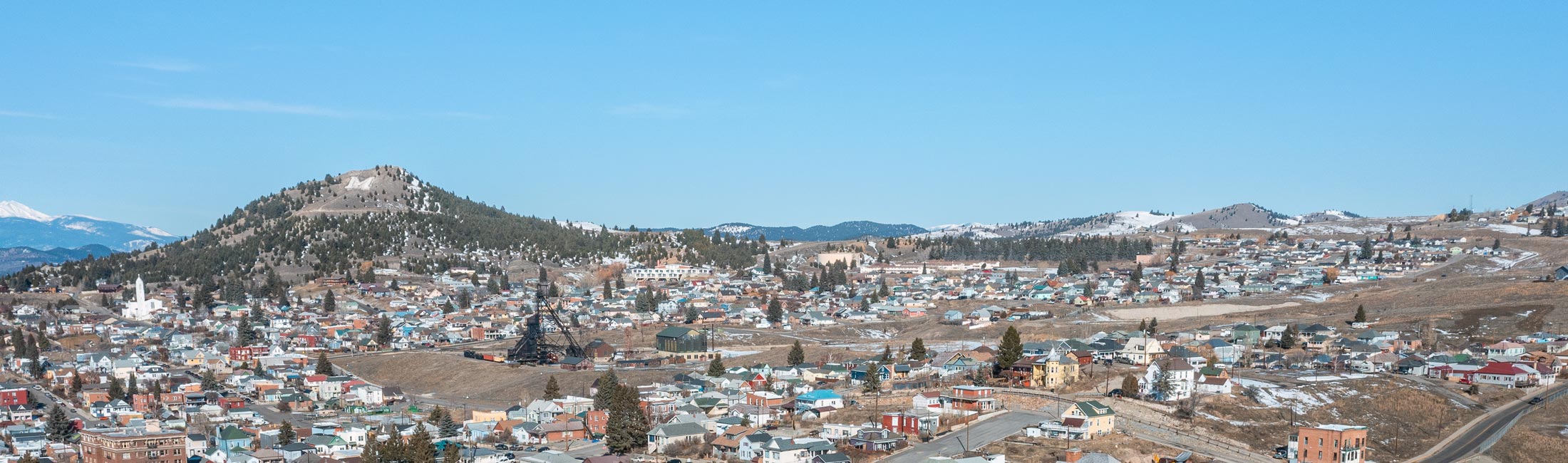 aerial view of buildings in Butte with foothills in background