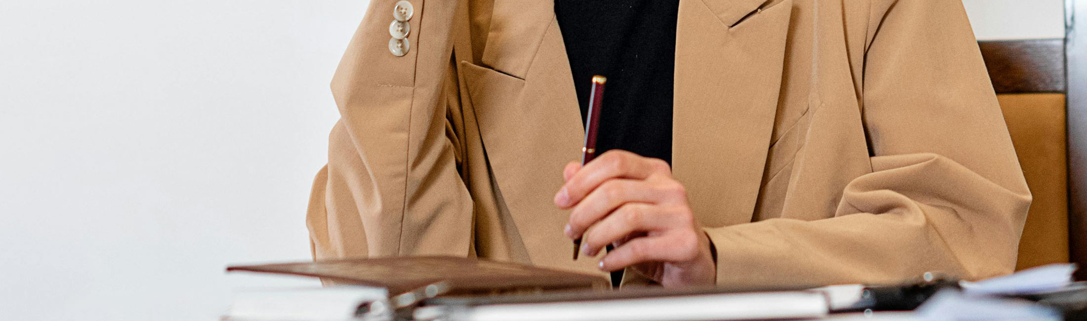 woman writing in notepad