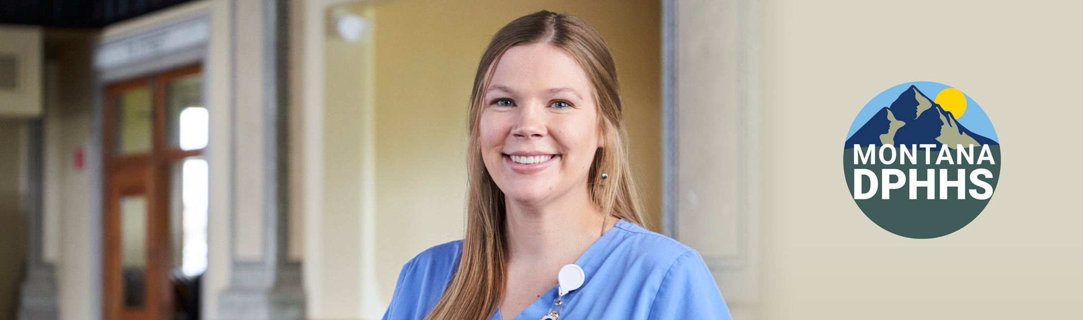 female nurse standing and smiling