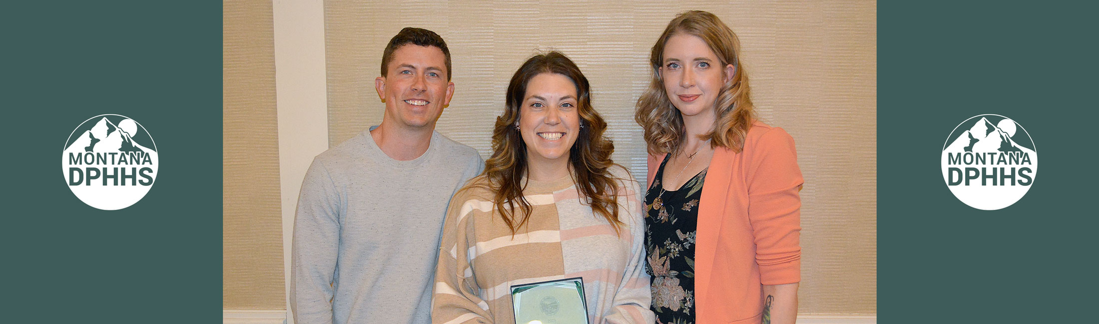 From left are Andrew and Kelsey Richards of Missoula and DPHHS Child Protection Specialist Jessica Sorenson. On Thursday, the Richards were presented with the Jana Elliott Memorial Resource Parents of the Year award, along with co-recipient Tawna Robinson of Billings standing and holding award. 