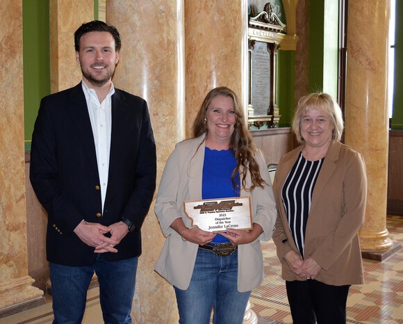 911 Dispatcher of the Year Award recipient Jennifer LaCross of Gallatin County 911, with DPHHS Director Charlie Brereton and Lt. Governor Kristen Juras