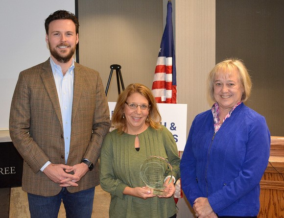 Award recipient Valerie Cummings of Plentywood is shown with DPHHS Director Charlie Brereton and Lt. Governor Kristen Juras.