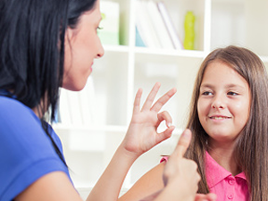  Woman and girl using sign language